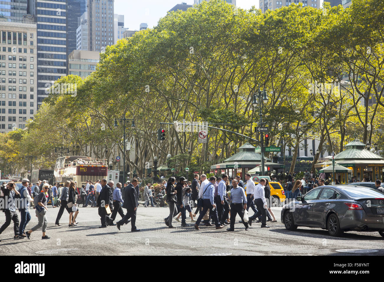 Trees line Bryant Park along 42nd Street by 6th Avenue in New York City ...
