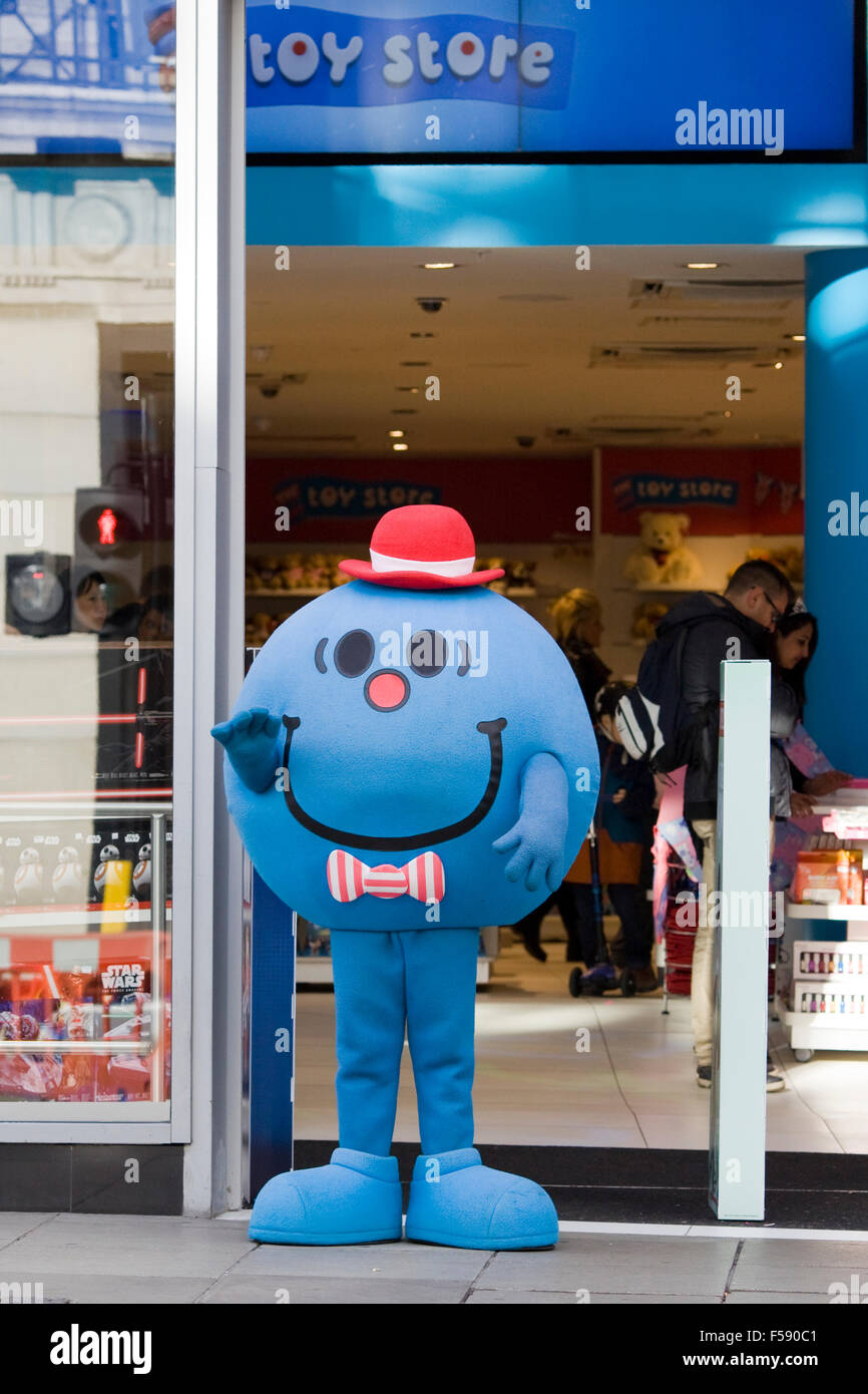 Man dressed as Mr Perfect from the Mr Men at a toy store Stock Photo