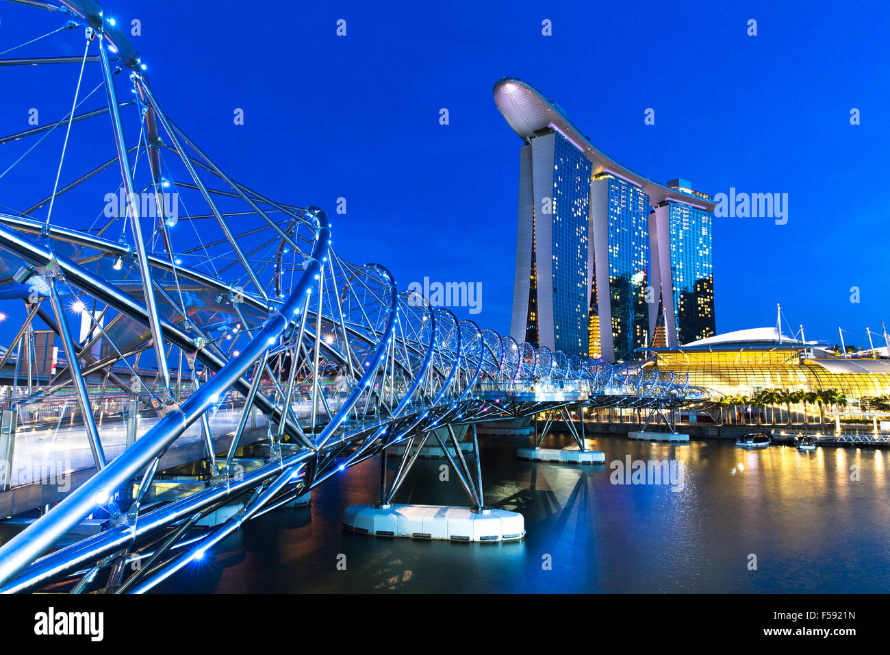 Singapore - July 10: Helix Bridge leading to Marina Bay Sands Hotel, 10 July 2013. Stock Photo