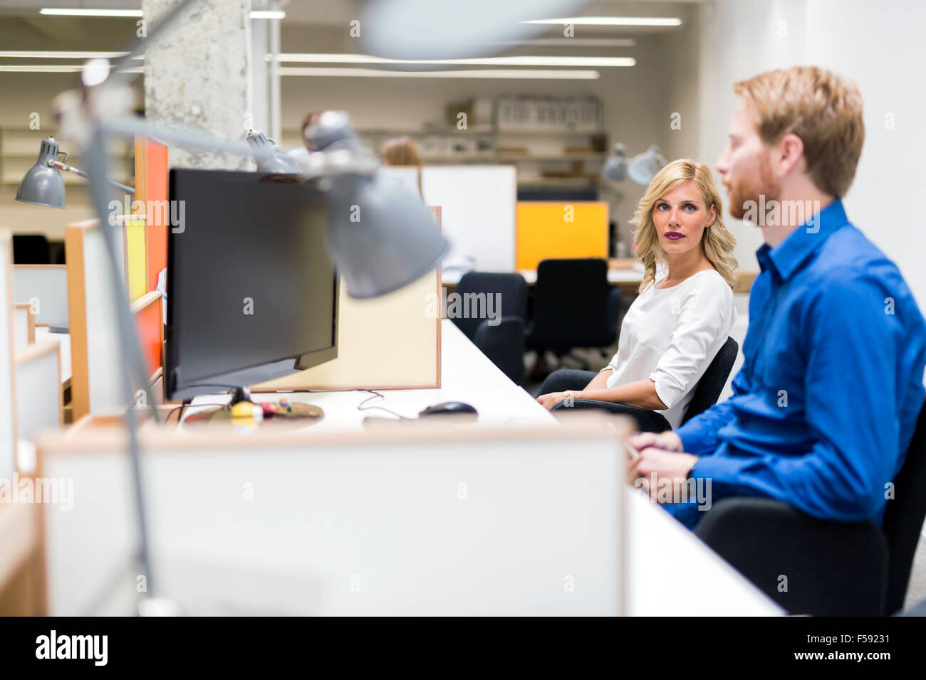 Attractive blonde woman talking hi-res stock photography and images - Alamy