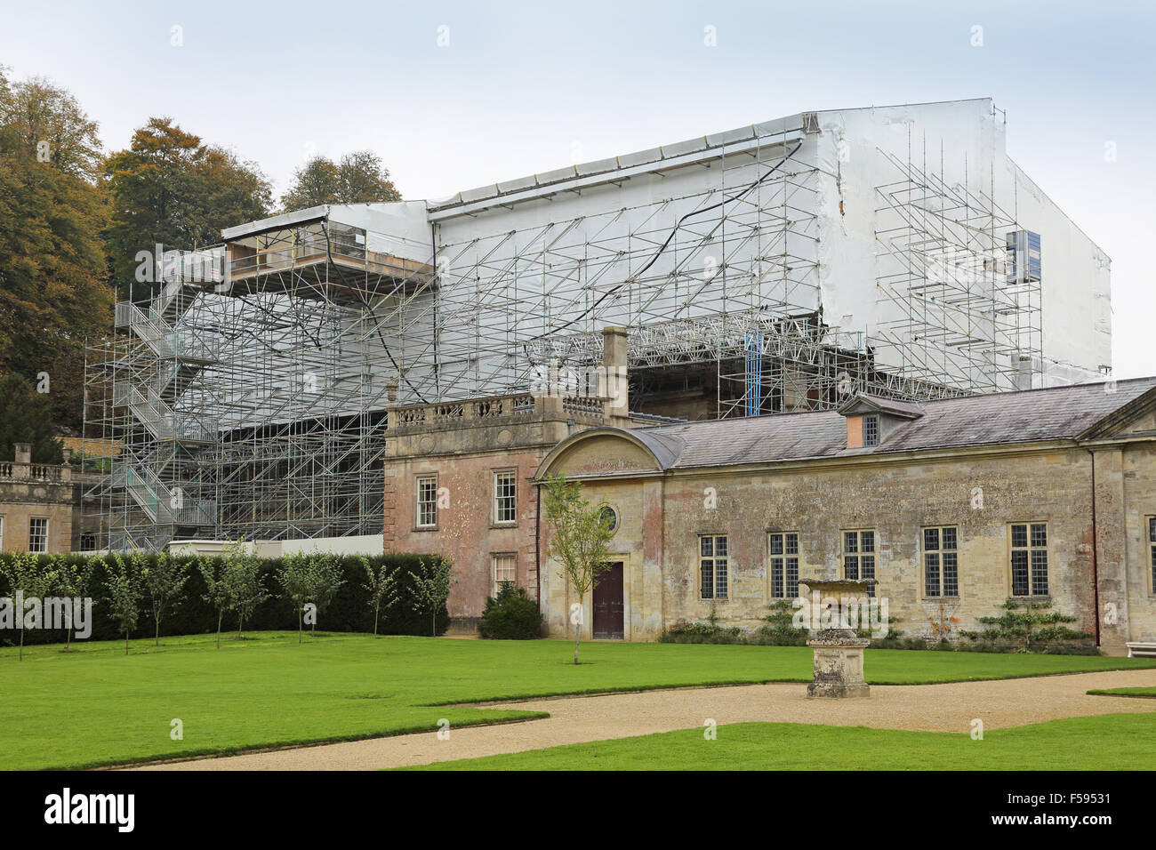 A protective scaffolding structure encloses Dyrham House, a stately home near Bath during major refurbishment work in 2015 Stock Photo
