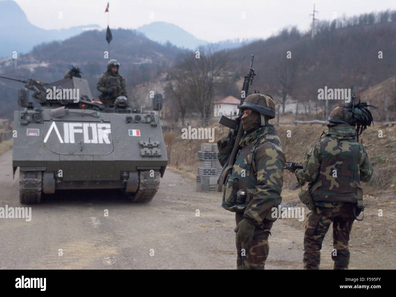 NATO intervention in Bosnia-Herzegovina after Dayton Accords, Italian Army soldiers, patrolling road near Sarajevo, January 1996 Stock Photo