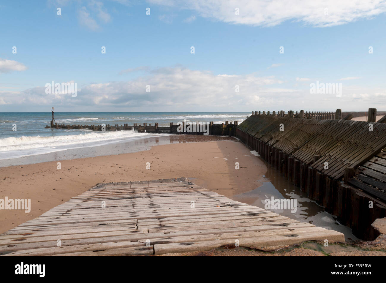 Wooden Groynes and sea defences at Walcott Norfolk Stock Photo