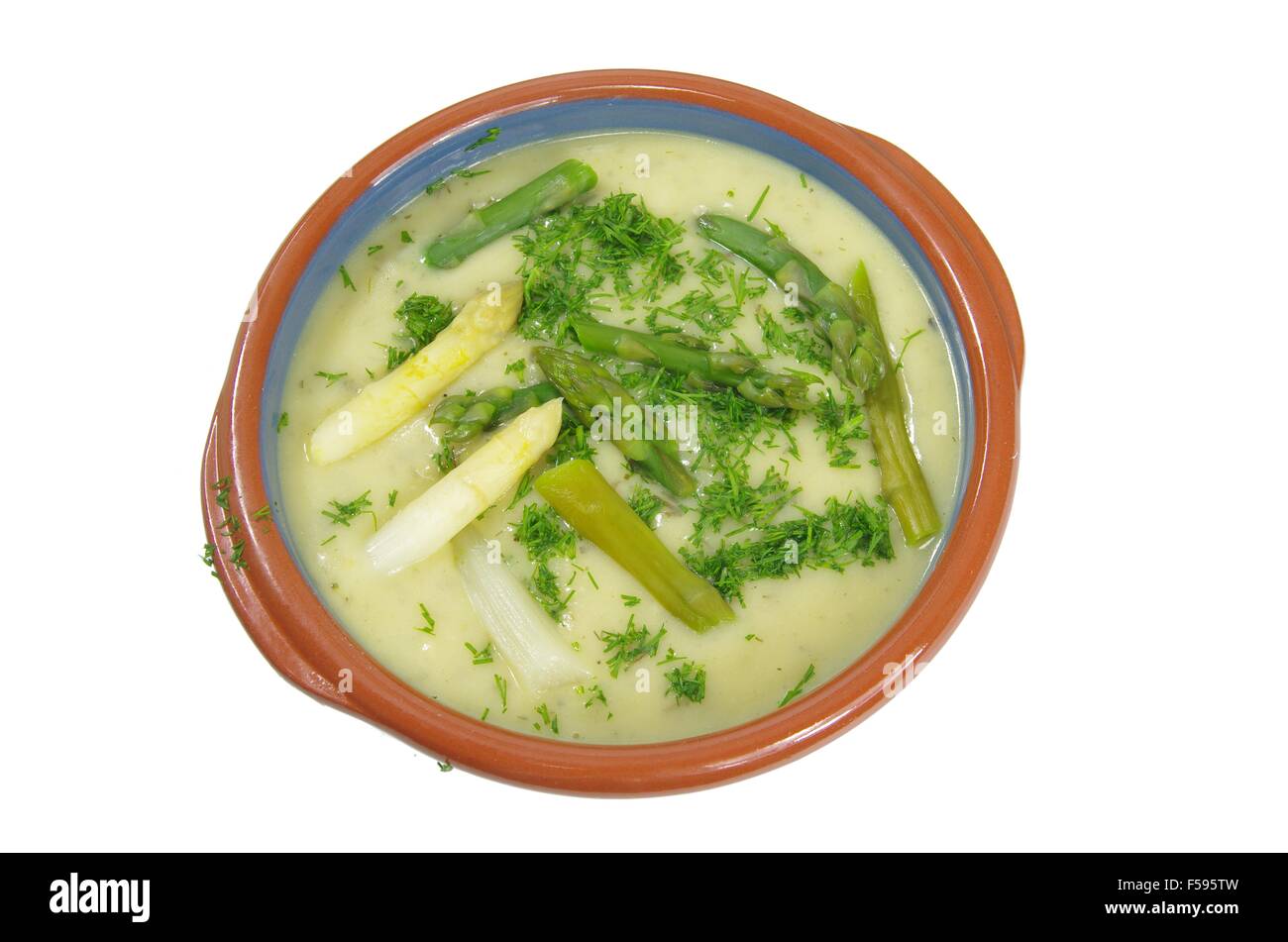 asparagus soup in plate on white background Stock Photo