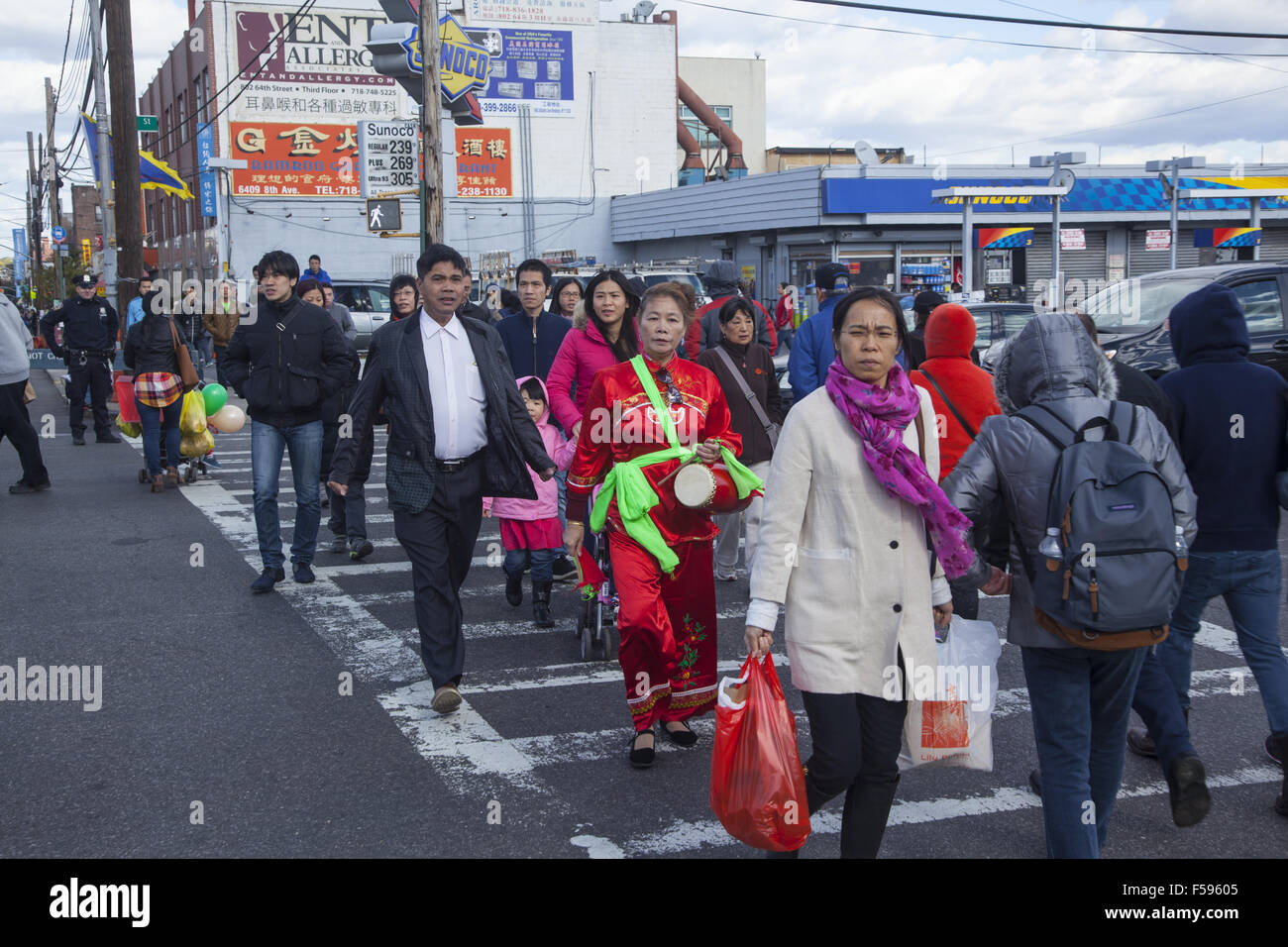 Local residents on the street on the day of the Chinese Autumn Festival and Lantern Parade in the Chinatown neighborhood of Broo Stock Photo