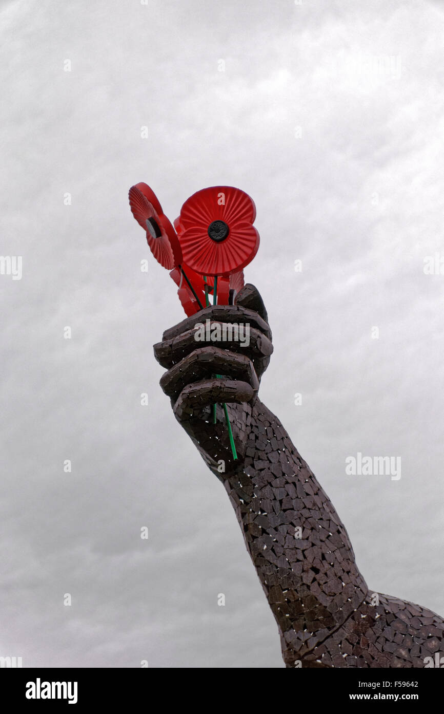 remembrance poppies on iron sculpture Stock Photo