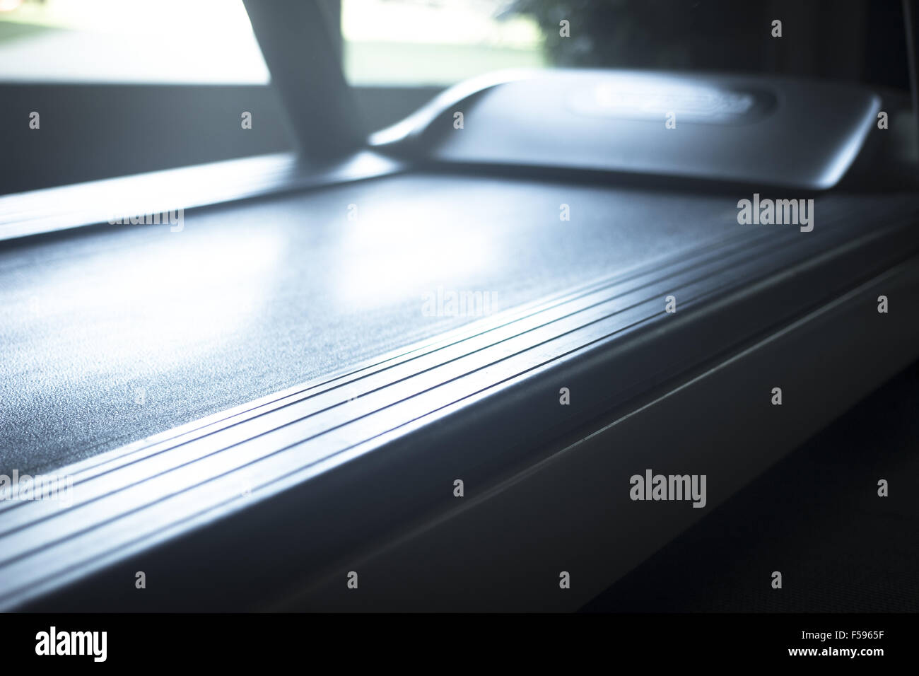Running machine in exercise room in sports bodybuilder gym health club