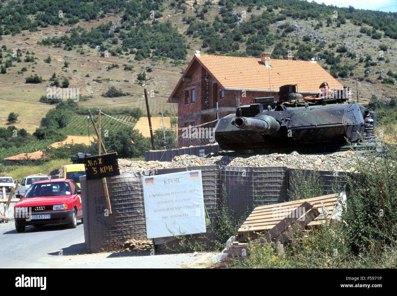 NATO intervention in Kosovo, July 2000, checkpoint of the German army with a Leopard 2 tank near the town of Orahovac. Stock Photo