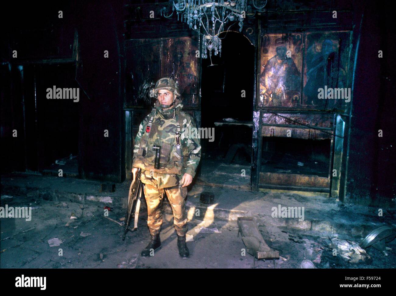 Kosovo crisis, Italian bersagliere soldier inside an orthodox church burnt by Albanians(July 2000) Stock Photo