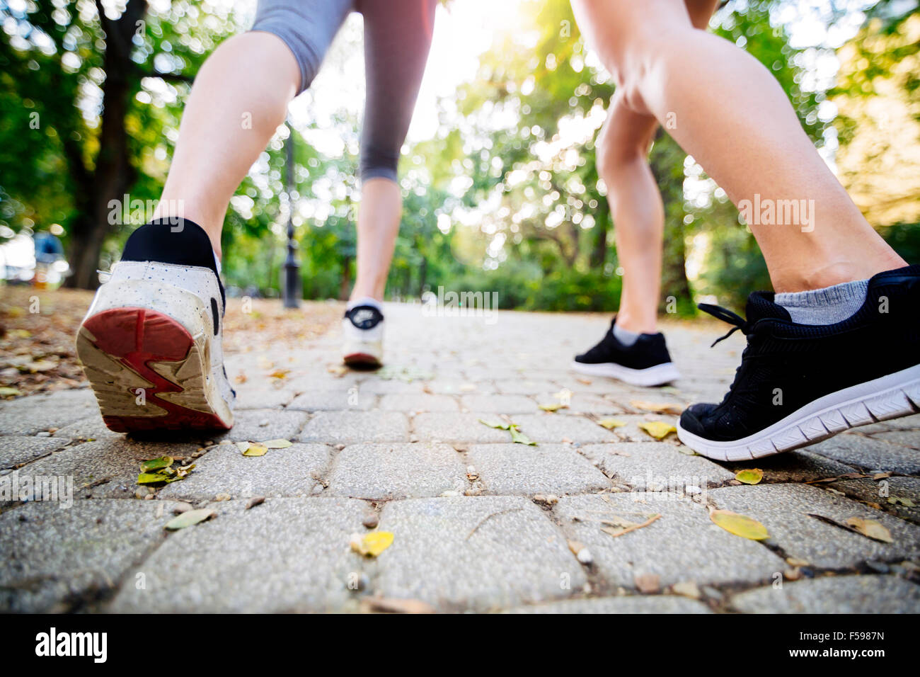 Closeup of joggers feet while in action and running Stock Photo