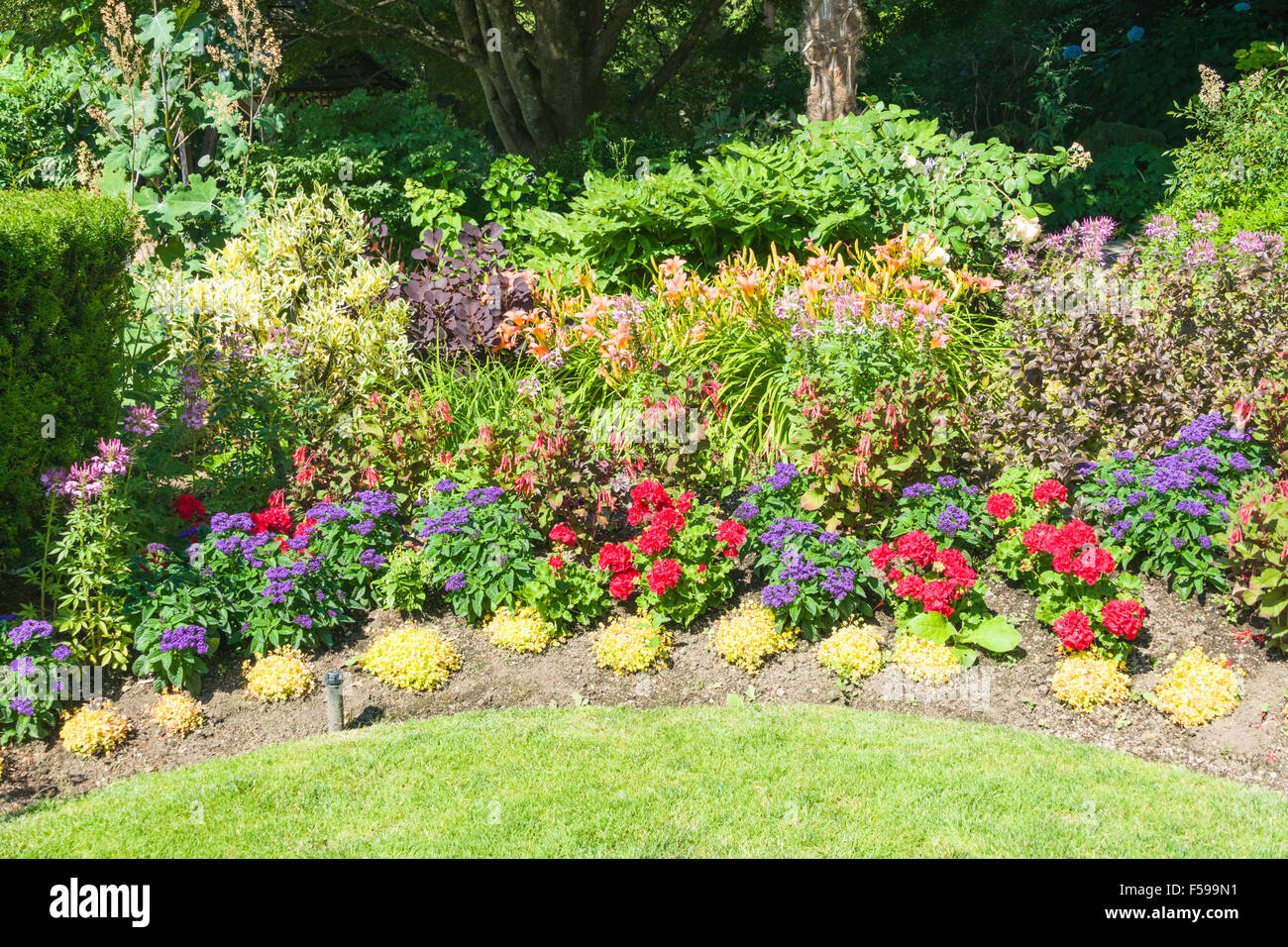 Flower garden at The Teahouse in Stanley Park, at Ferguson Point, Stanley Park, Vancouver, BC, Canada Stock Photo