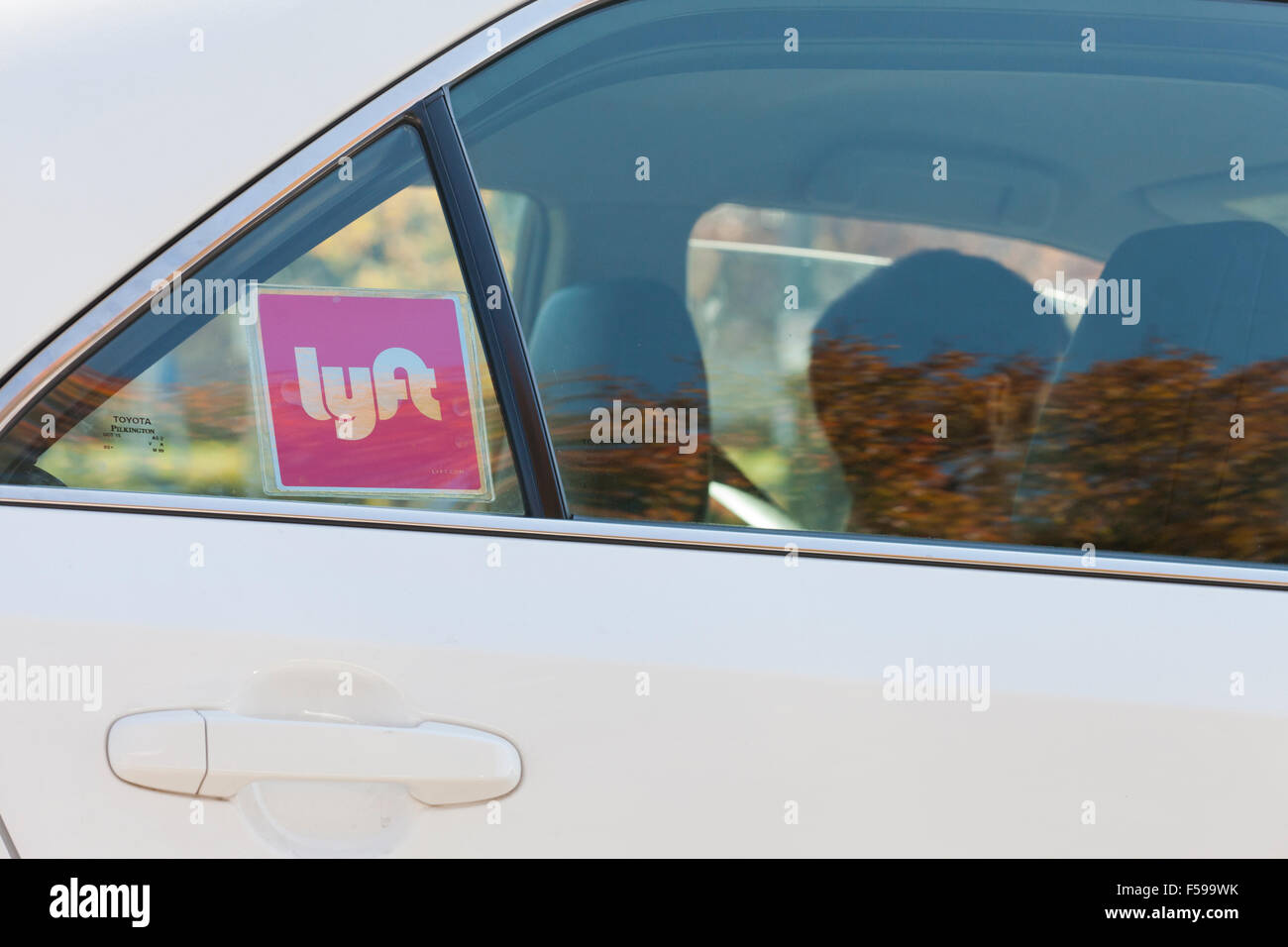 Lyft ridesharing sticker on car - Washington, DC USA Stock Photo