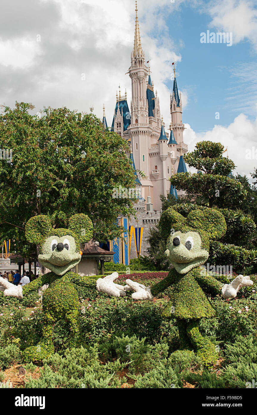 Mickey and Minnie Mouse at Disney World USA with Cinderella's castle in the background. Stock Photo