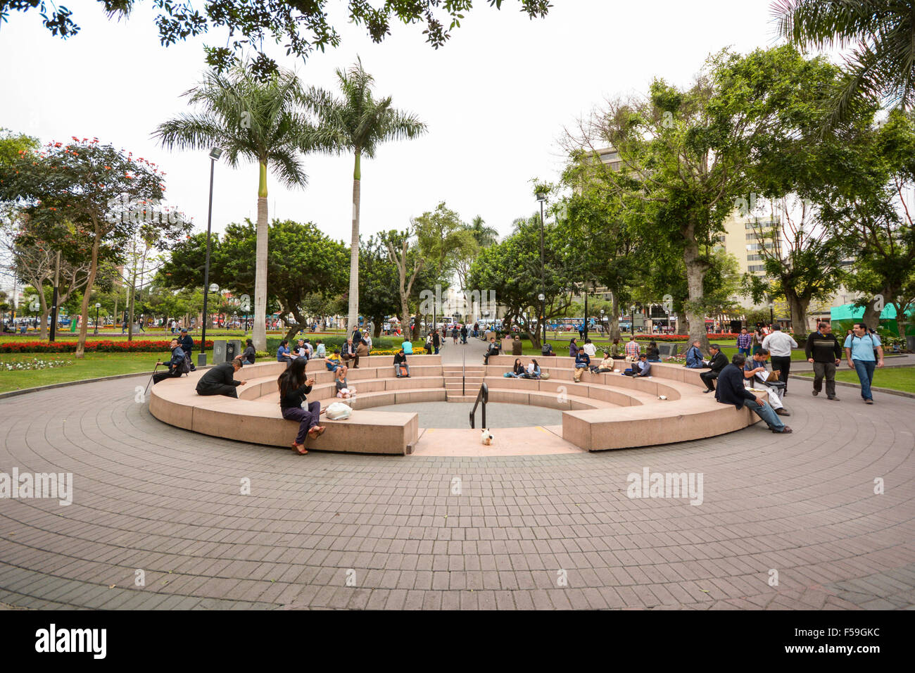 People relaxing in Central Park in Miraflores, Lima, Peru Stock Photo