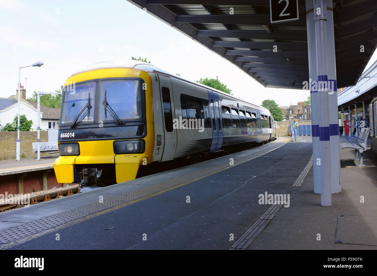 An overground South train waiting at the a platform at Greenwich