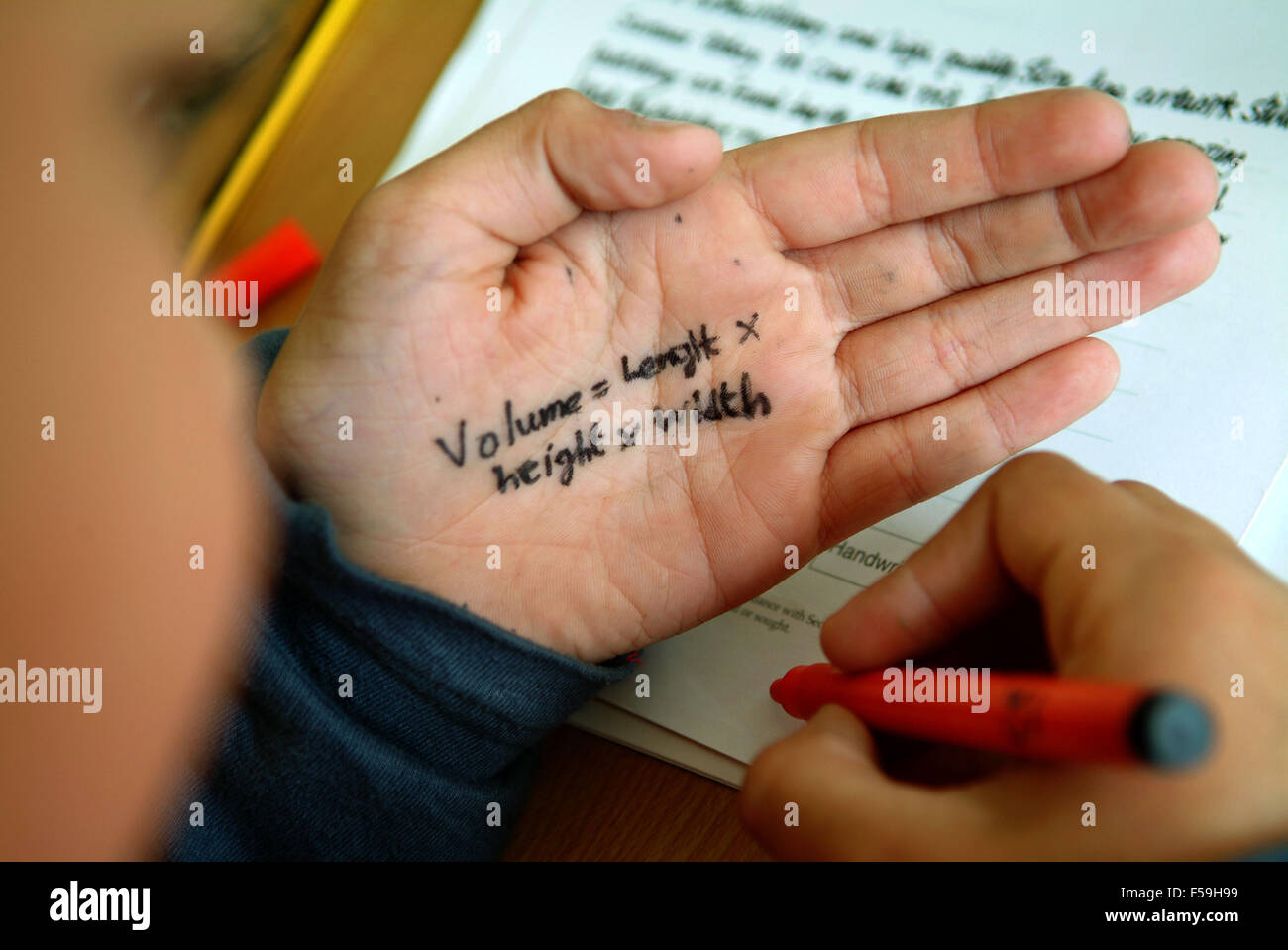 Students sitting their year 6 SATs test at Roath Park Primary School,Cardiff, Wales,UK,with one boy cheating.a UK education exam Stock Photo