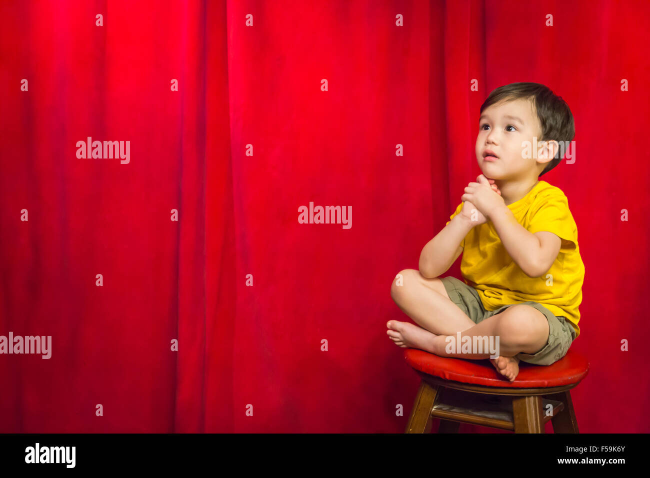 Boy sitting on stool hi-res stock photography and images - Alamy