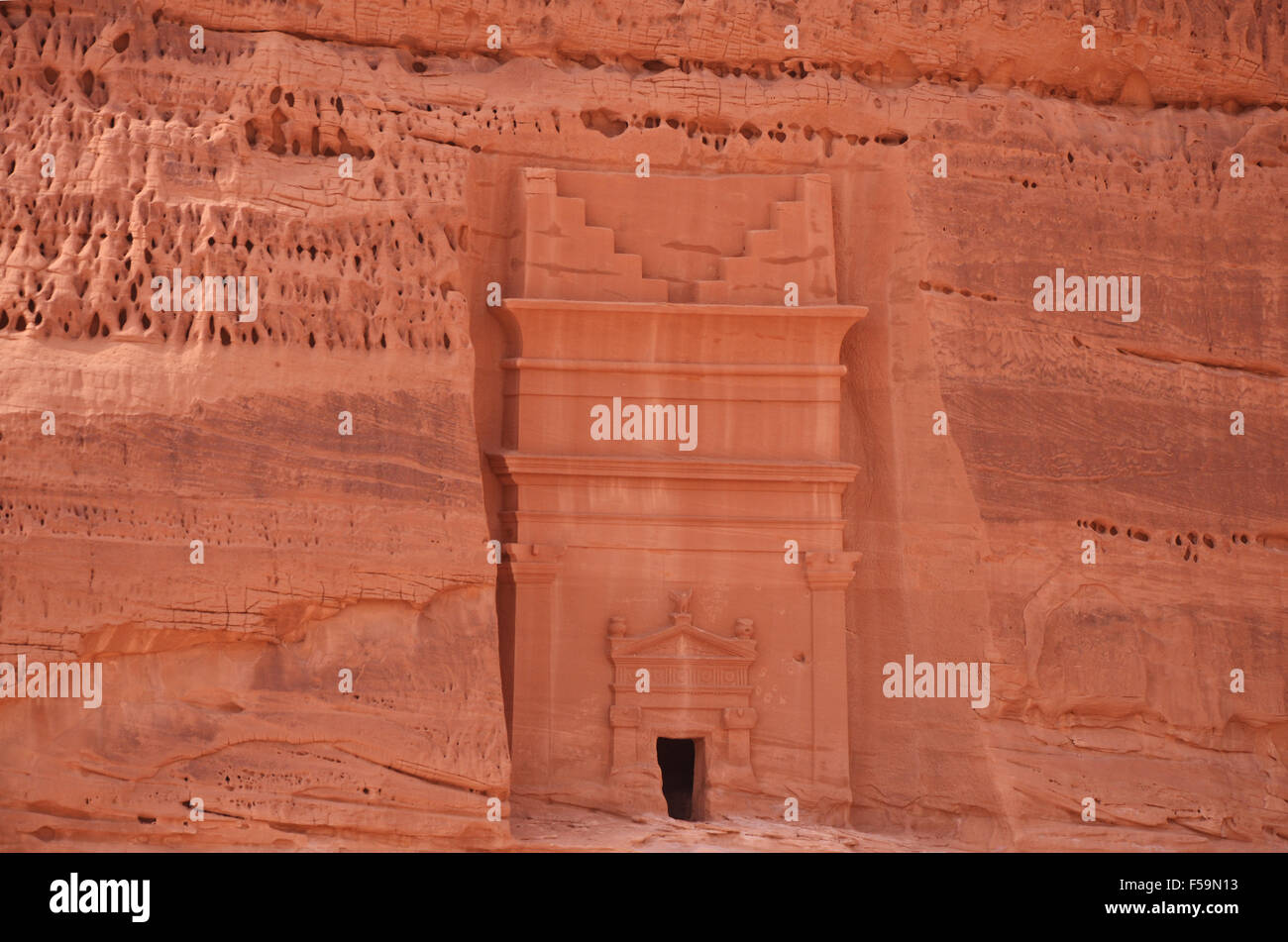 Nabatean  tomb entrance in rock, Archeological site in desert landcape, saudi arabia Stock Photo