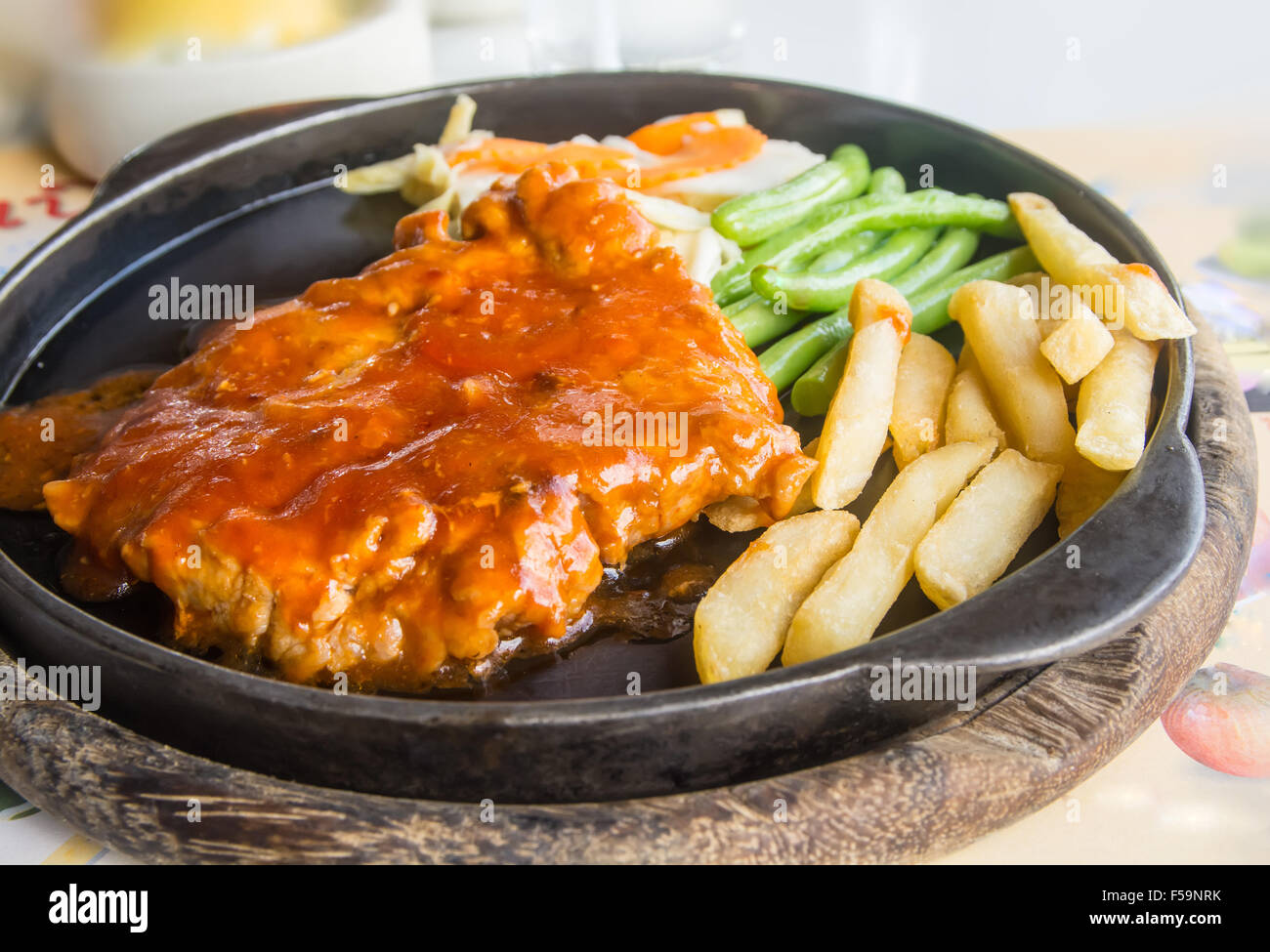 steak and chips on black plate Stock Photo Alamy