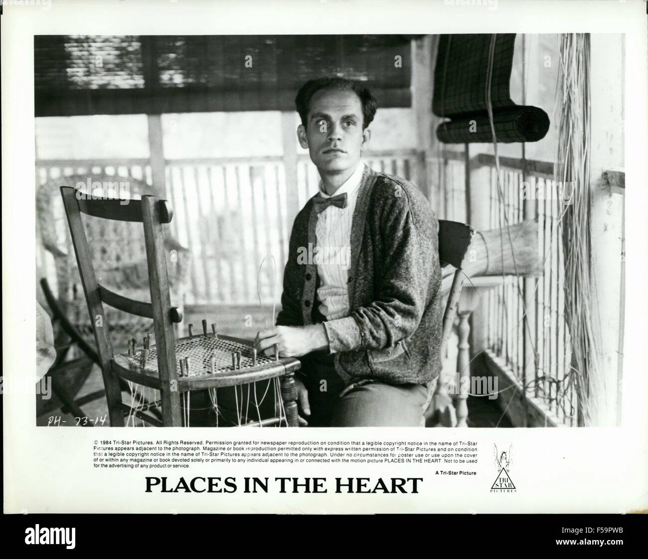 1984 - John Malkovich as Mr. Will, a blind World War I veteran, canes chairs as occupational theraphy and way to earn bed and board in Robert Benton's new film, Places in the Heart, for release by Tri-Star. © Keystone Pictures USA/ZUMAPRESS.com/Alamy Live News Stock Photo
