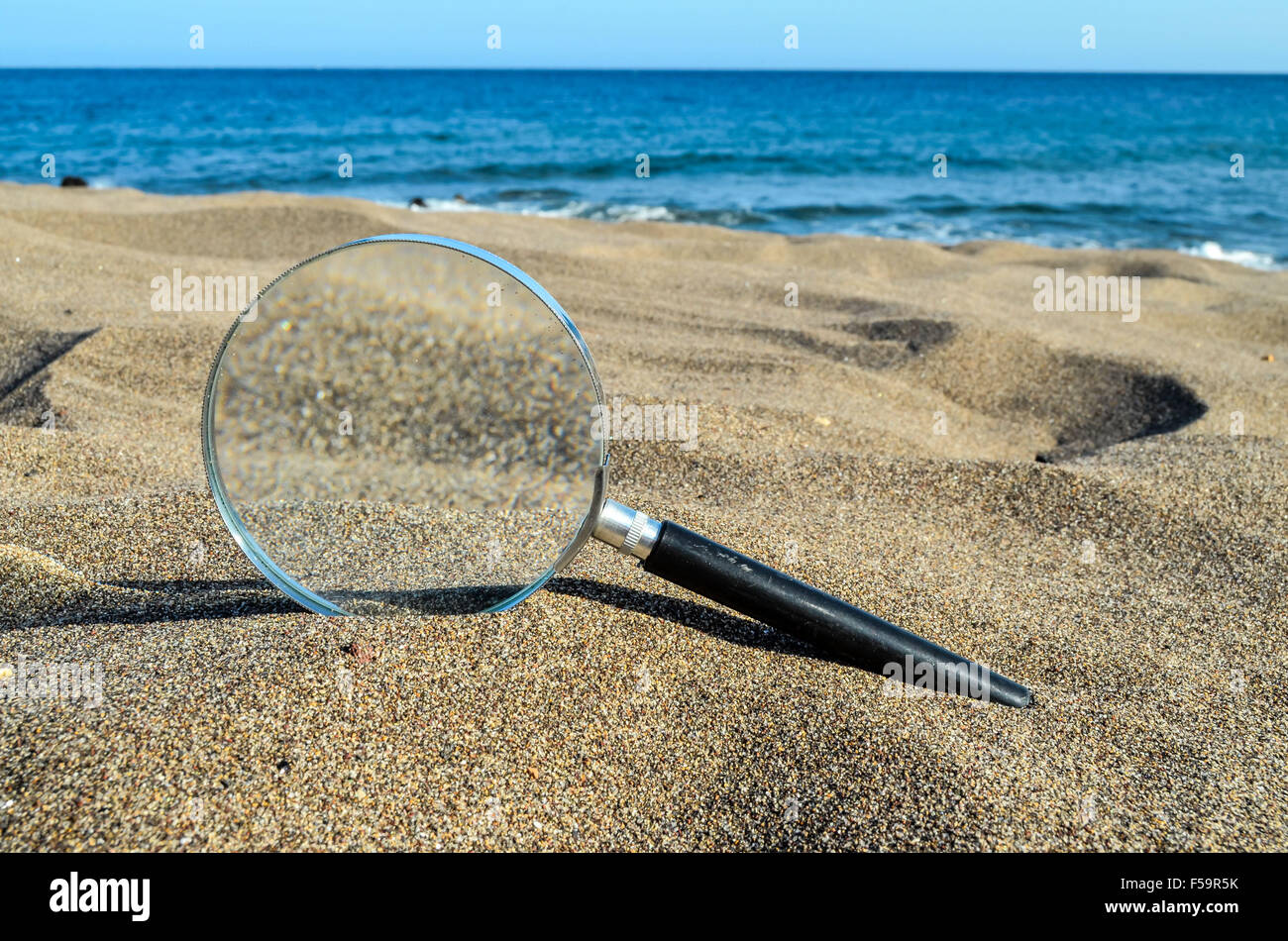 Magnify Glass On The Sand Beach Stock Photo Alamy