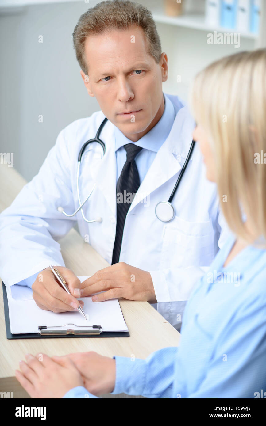 professional-doctor-examining-his-patient-stock-photo-alamy