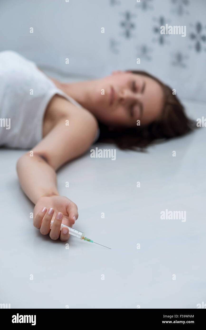 Depressed girl lying on floor hi-res stock photography and images - Alamy