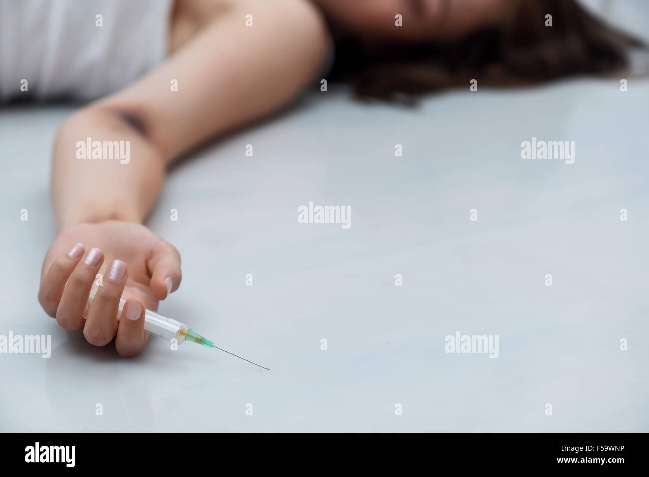 Depressed girl lying on floor hi-res stock photography and images - Alamy