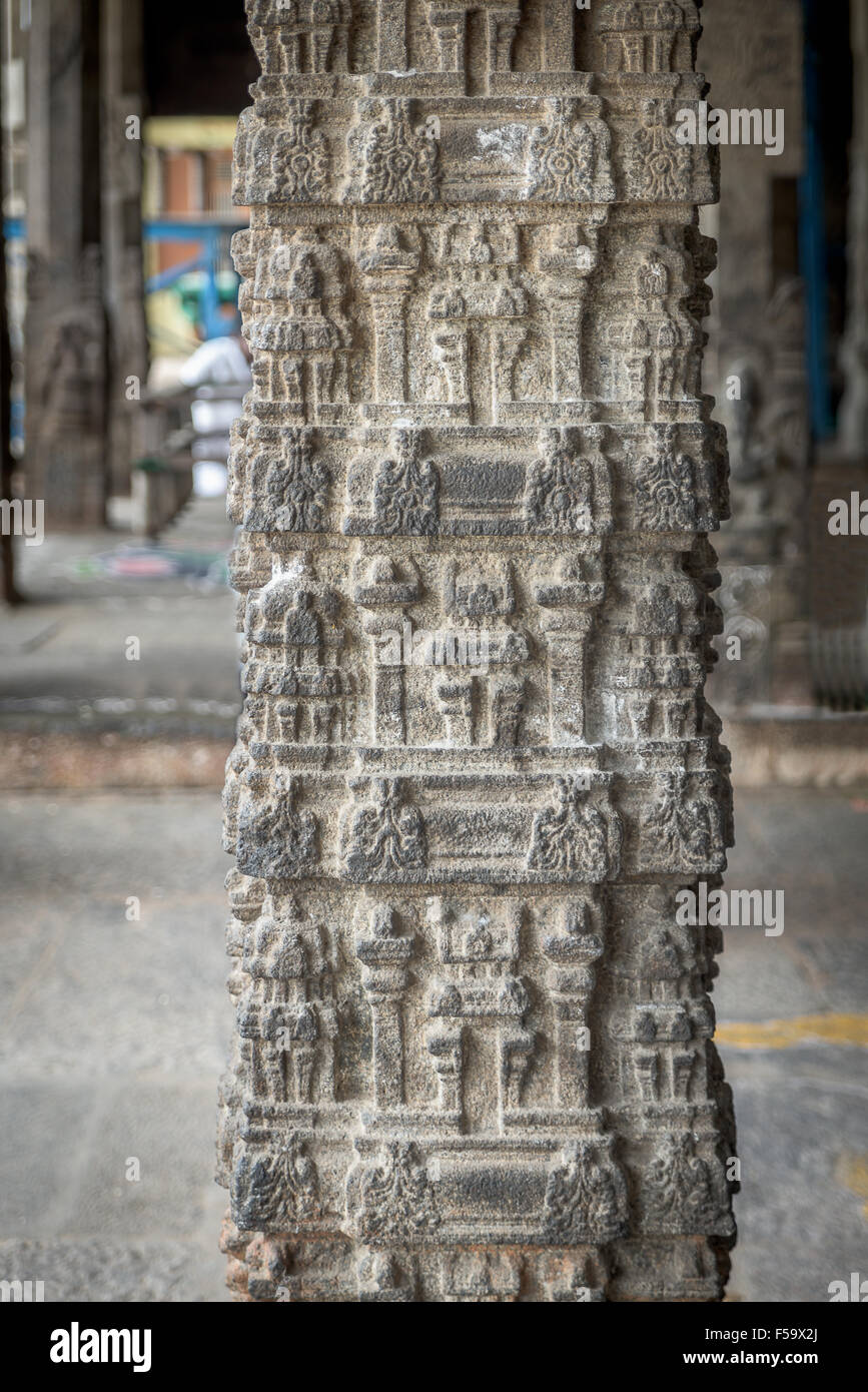 Intricate carvings on stone pillar in Hindu temple Stock Photo