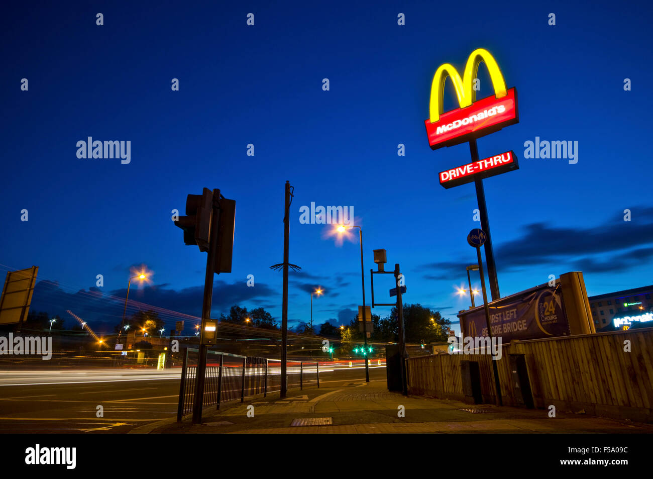A Drivethru McDonalds restaurant on a busy London roundabout Stock