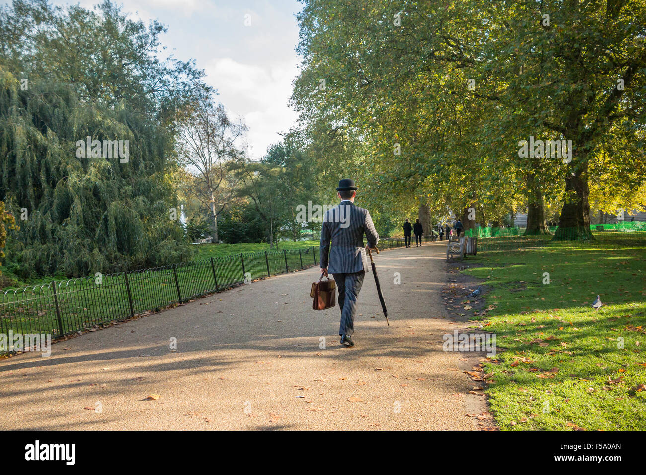 Businessman bowler hat umbrella hi-res stock photography and images - Alamy