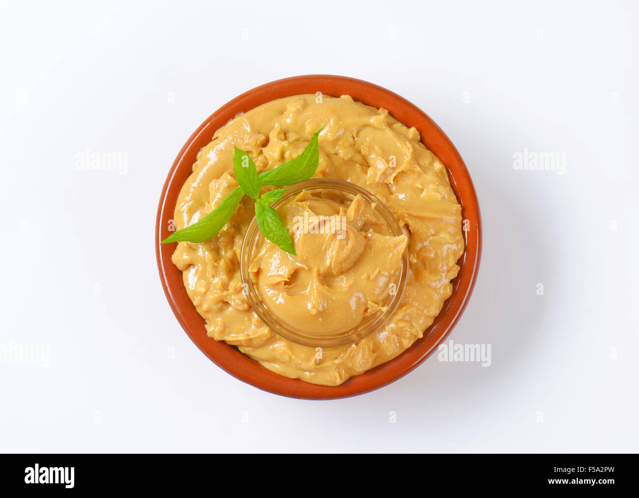Crunchy peanut butter in a bowl Stock Photo