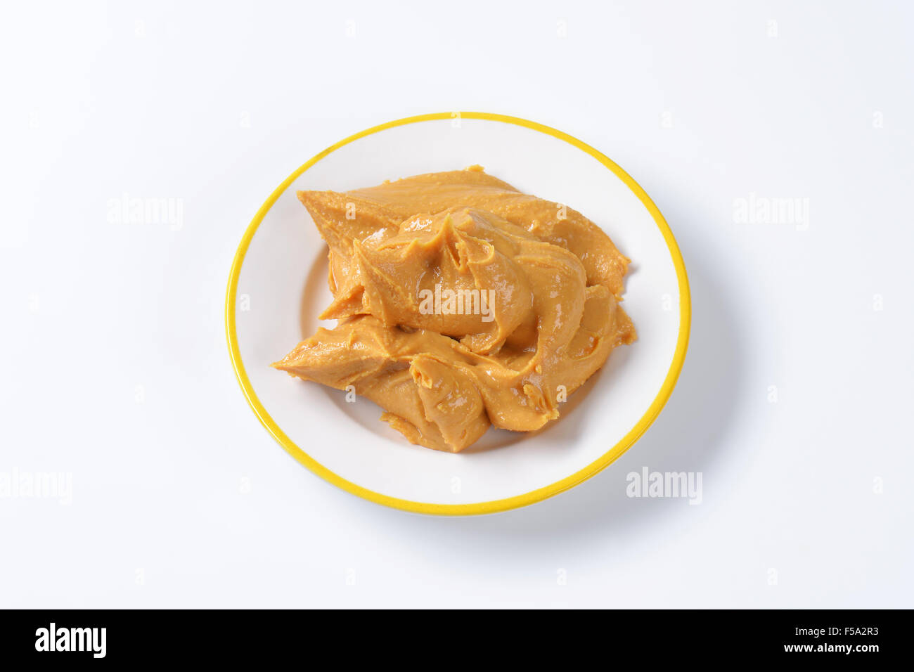 Creamy peanut butter on a plate Stock Photo