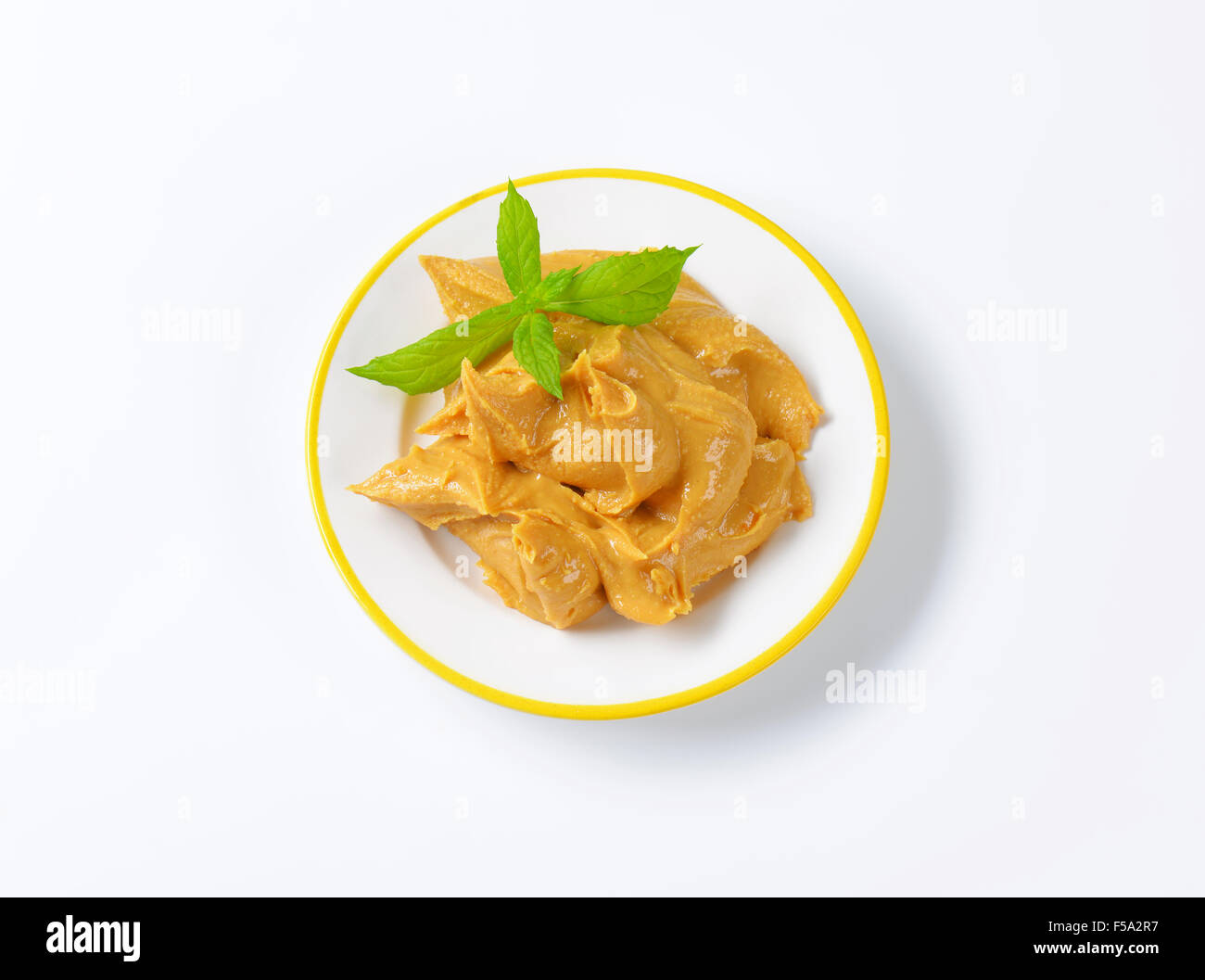 Creamy peanut butter on a plate Stock Photo