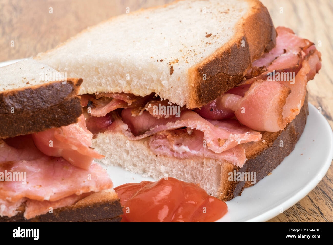 Delicious bacon sandwich with tomato ketchup Stock Photo Alamy