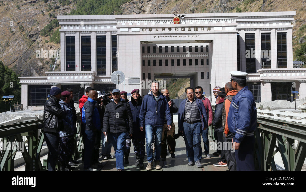 Rasuwa, Nepal. 31st Oct, 2015. Chinese officials welcome the fuel tankers of Nepal Oil Corporation (NOC) in Rasuwa, Nepal, Oct. 31, 2015. Nepal has sent four fuel tankers to China's Kerung on Saturday noon to receive the first batch of China's fuel grant to ease the fuel crisis in the country following India's blockade. Credit:  Sunil Sharma/Xinhua/Alamy Live News Stock Photo