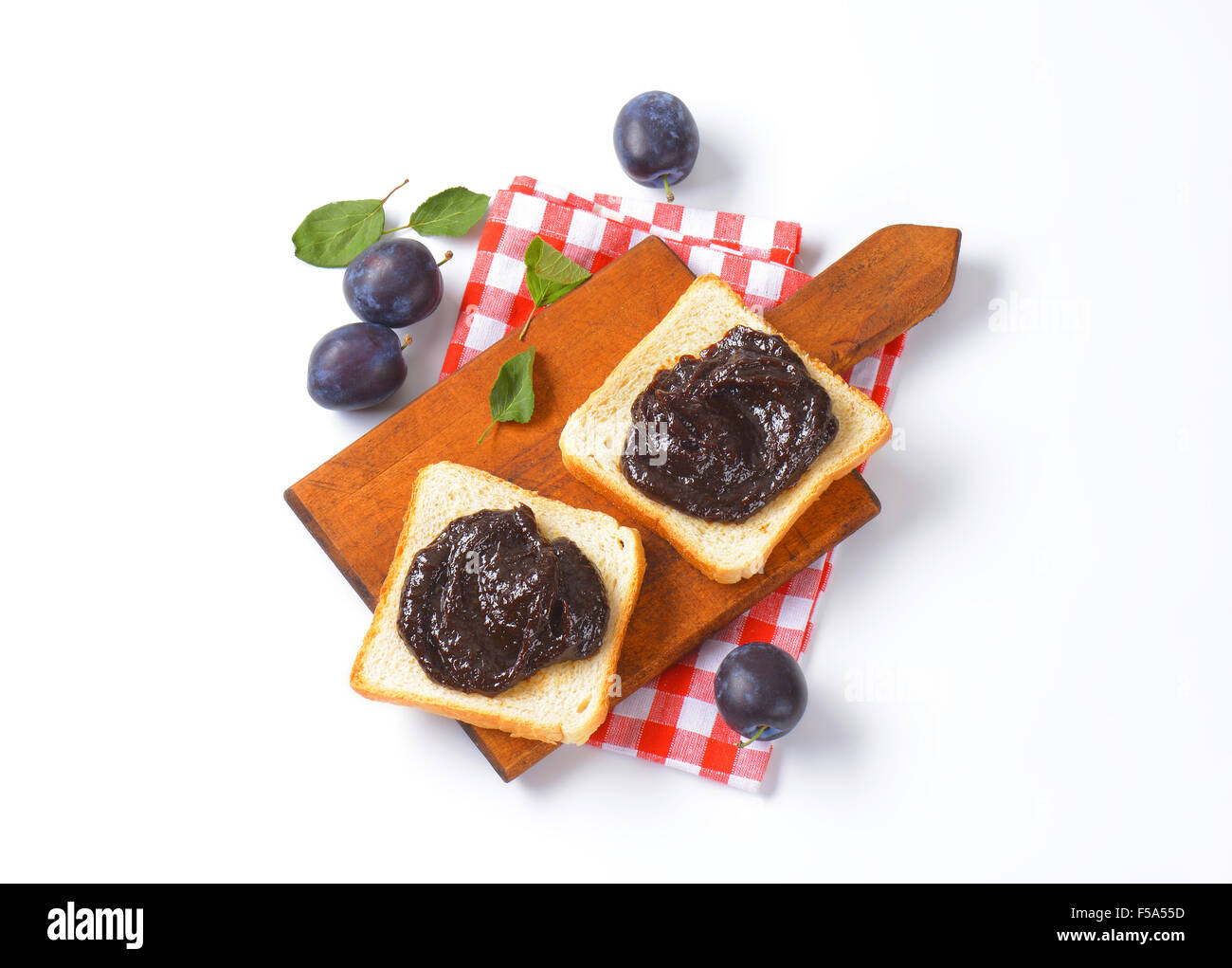 Slices of white bread with plum jam Stock Photo