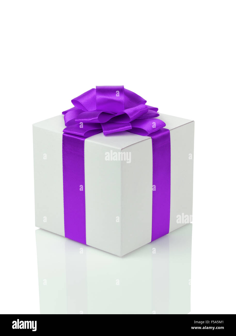 white paper gift box with purple ribbon bow isolated Stock Photo