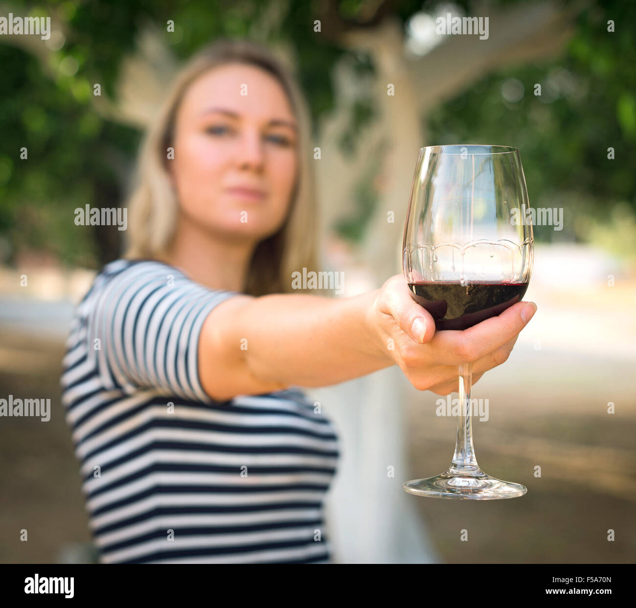Woman glass wine red offering hi-res stock photography and images - Alamy