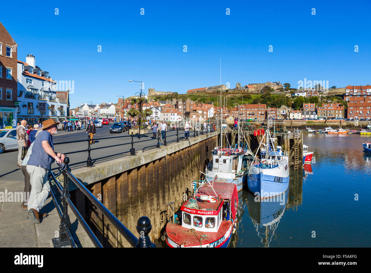 Fishing boats moored in the harbour in Whitby, North Yorkshire, England, UK Stock Photo