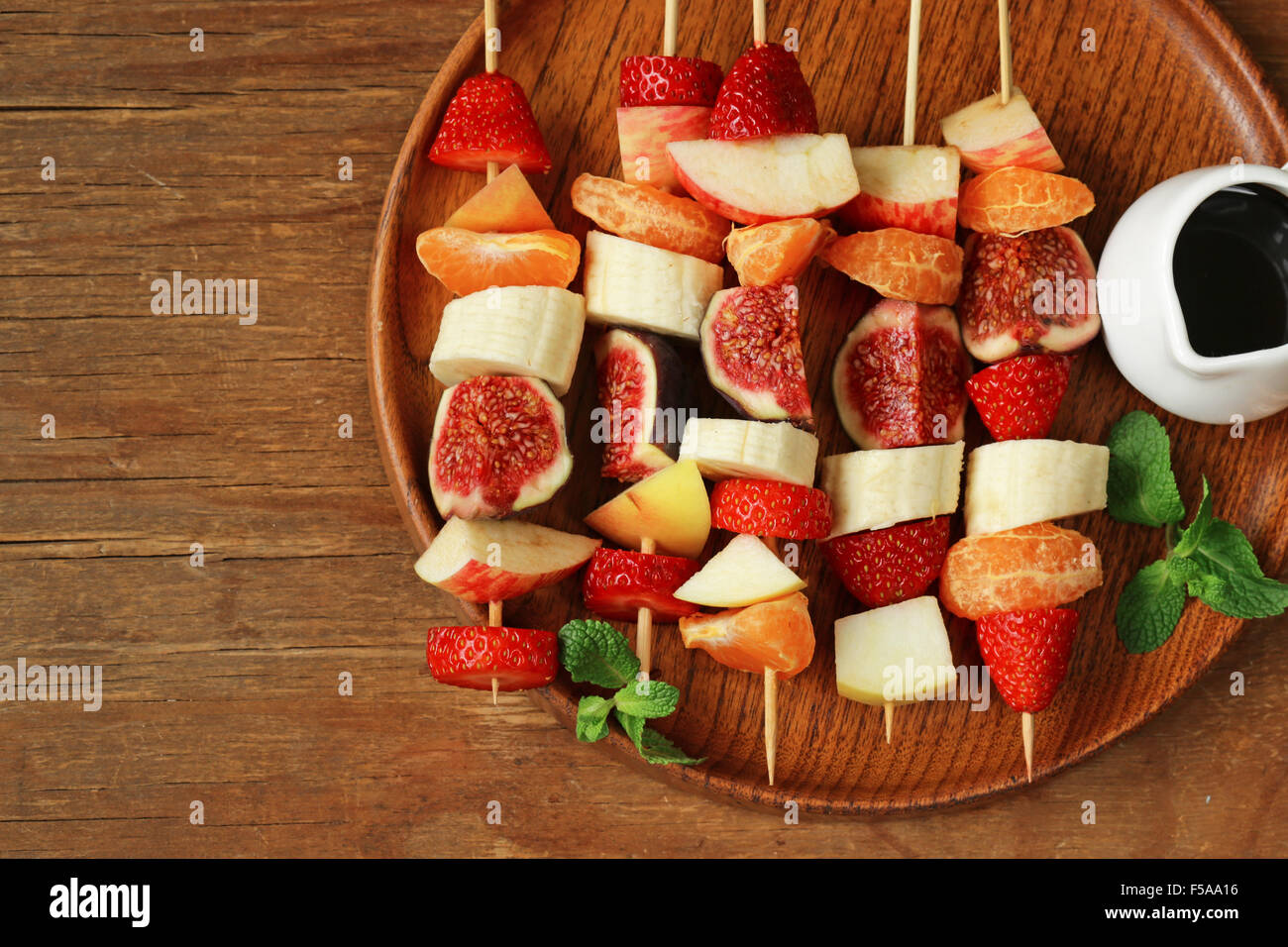 fruit on wooden skewers - dessert skewers Stock Photo - Alamy