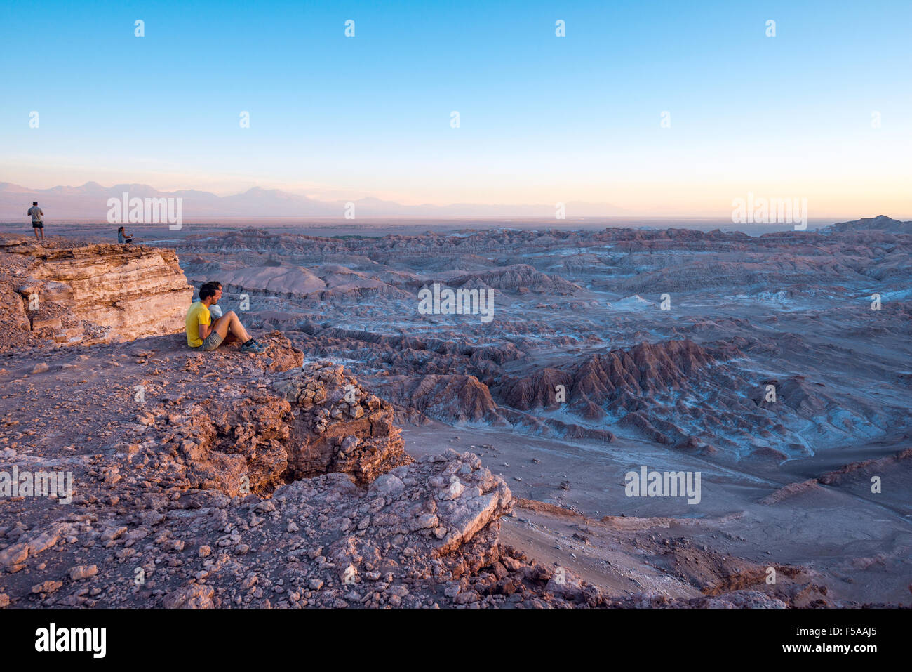 ATACAMA DESERT, CHILE - 7 DEC, 2014: Tourists make pictures in the Atacama desert, Chile. Atacama Desert proper occupies 105,000 Stock Photo