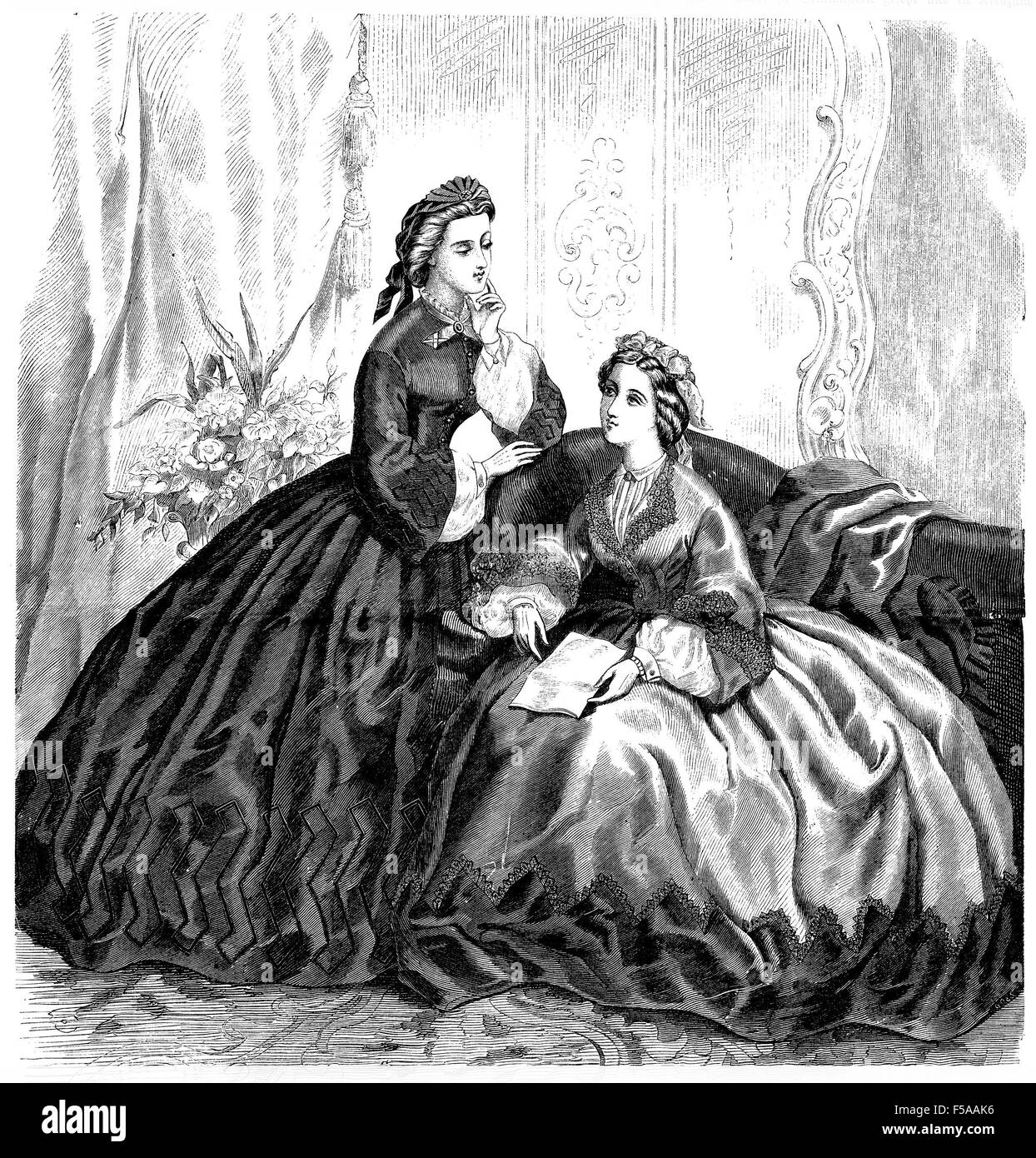 Vintage fashion illustrated, der Bazaar, Berlin 1862, ladies with robe at home Stock Photo