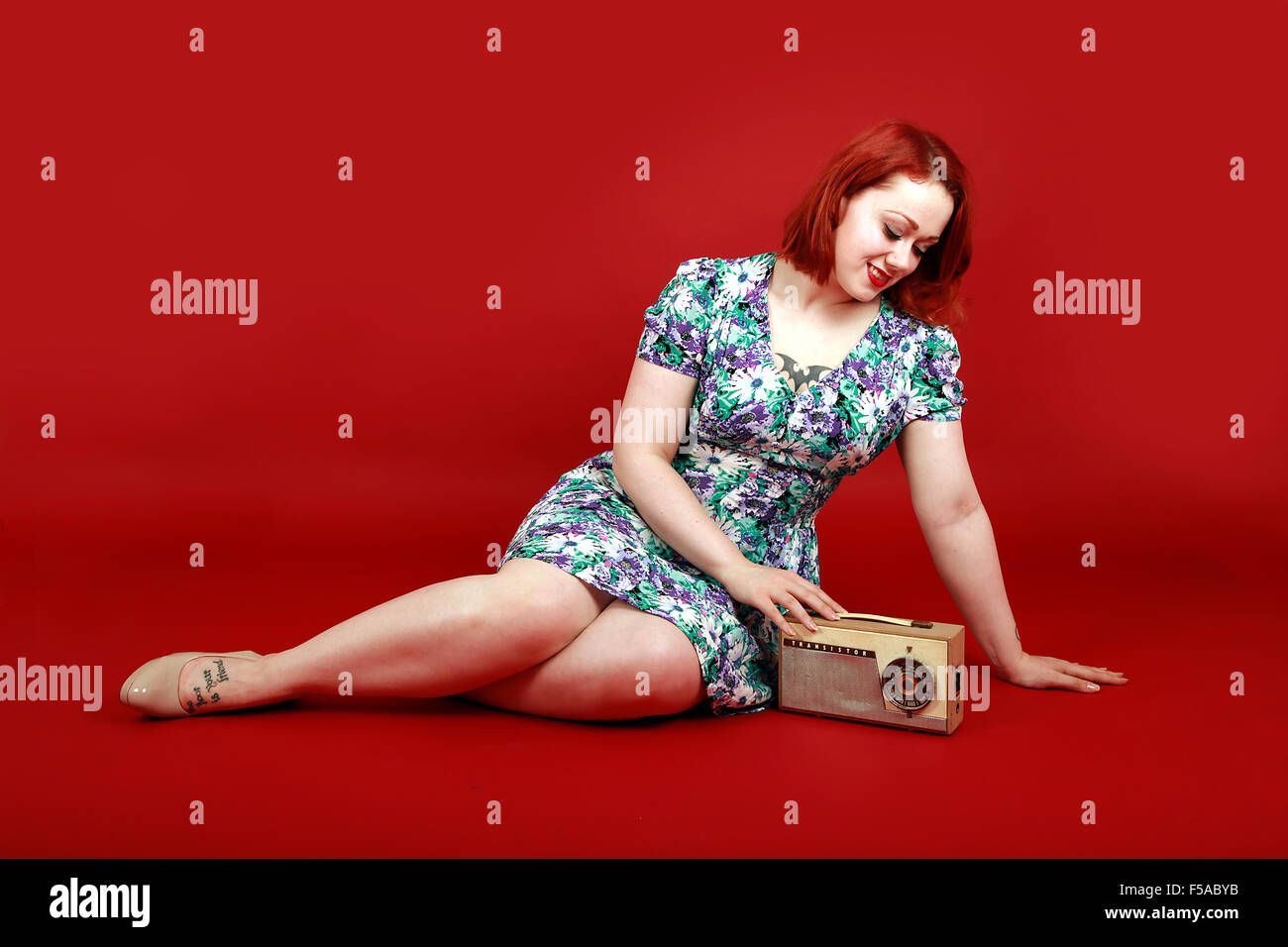 pinup girl with vintage transistor radio Stock Photo