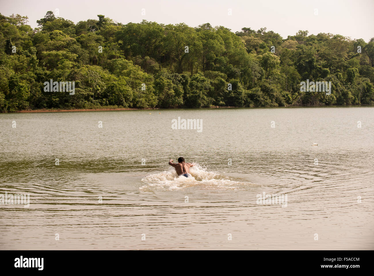 Palmas, Tocantins State, Brazil. 29th October, 2015. A competitor takes a warm-up swim before the men's swimming race at the International Indigenous Games, in the city of Palmas, Tocantins State, Brazil. Credit:  Sue Cunningham Photographic/Alamy Live News Stock Photo