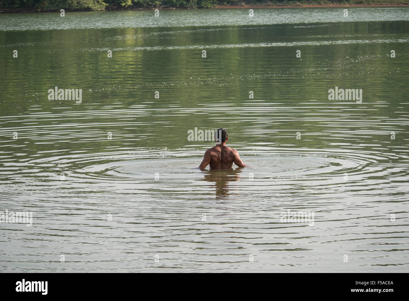 Palmas, Brazil. 30th October, 2015. A competitor takes a warm-up swim before the men's swimming race at the International Indigenous Games, in the city of Palmas, Tocantins State, Brazil. Credit:  Sue Cunningham Photographic/Alamy Live News Stock Photo