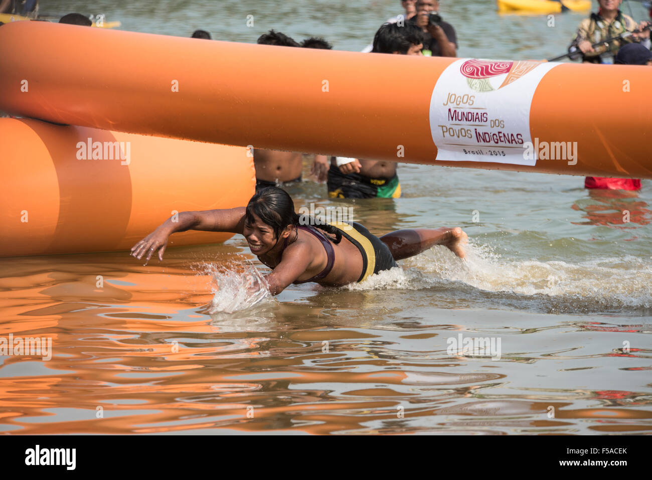 Palmas, Brazil. 30th October, 2015. Amkrokwi Gaviåo, winner of the women's swimming heat, crosses the finishing line during the women's swimming event at the International Indigenous Games, in the city of Palmas, Tocantins State, Brazil. Credit:  Sue Cunningham Photographic/Alamy Live News Stock Photo