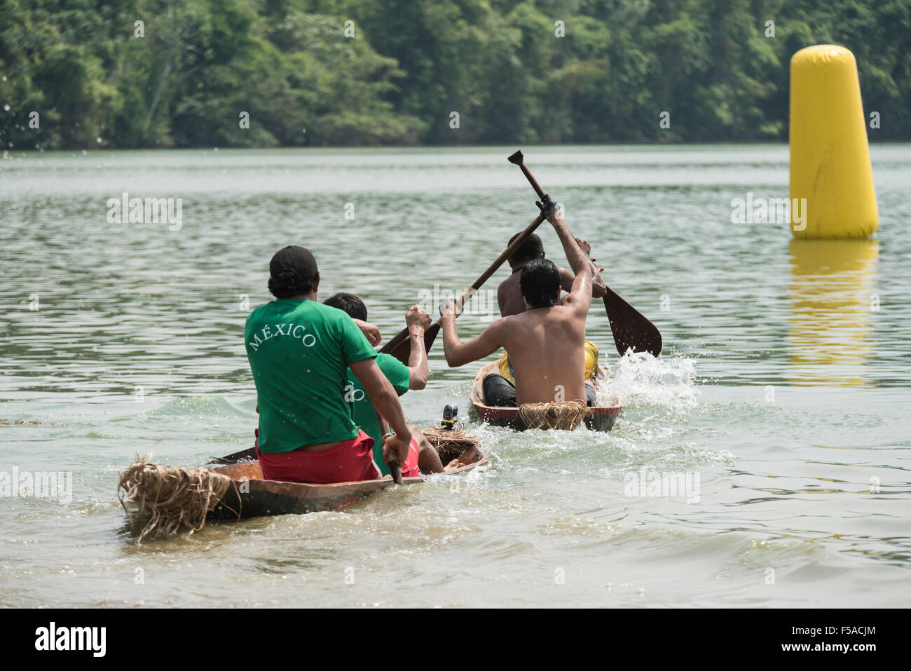 Palmas, Brazil. 30th October, 2015. The Mexican team close in on another canoe as they near the marker buoy during the canoeing event at the International Indigenous Games, in the city of Palmas, Tocantins State, Brazil. Credit:  Sue Cunningham Photographic/Alamy Live News Stock Photo