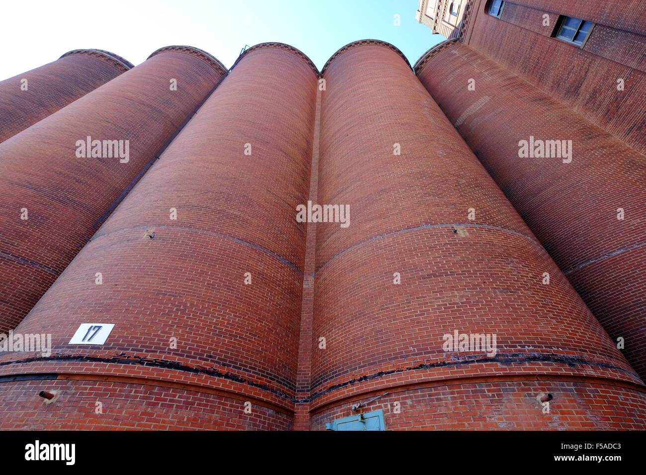 Large grain storage facility at beer brewery Stock Photo
