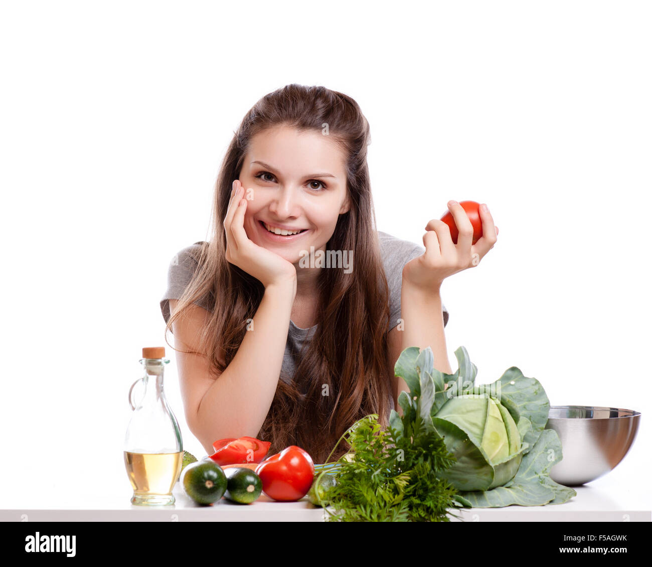 Young Woman Cooking in the kitchen. Healthy Food - Vegetable Salad. Diet. Dieting Concept. Healthy Lifestyle. Cooking At Home. P Stock Photo